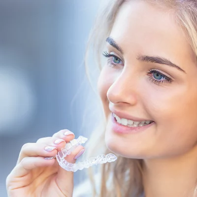 A girl Smiling After Invisalign Treatment